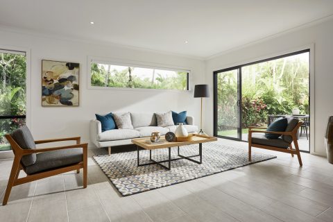 Aluminium Sliding Doors in a lounge room with light streaming through them